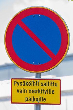 Prohibition sign: No parking,  Parking is only allowed on marked spaces (PysÃ¤kÃ¶inti sallittu vaan merkityille paikoille) in Finland.の写真素材