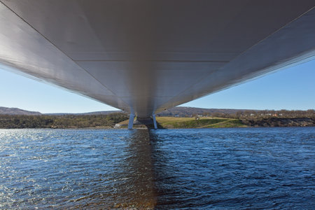 Underside view of Tana bridge in clear summer weather, Tana Bru, Norway.