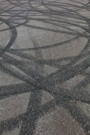 Closeup of burned rubber tire tracks on asphalt.の写真素材