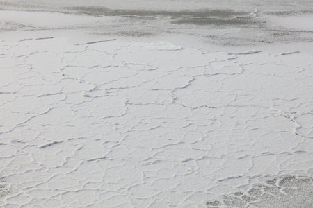 Frozen sea ice covered with snow in winter.