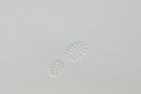 Closeup of footprint in fresh snow in winter.