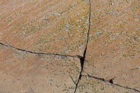 Closeup of seamless rock texture with cracks for backgrounds, Tiirakari, Helsinki, Finland.の写真素材