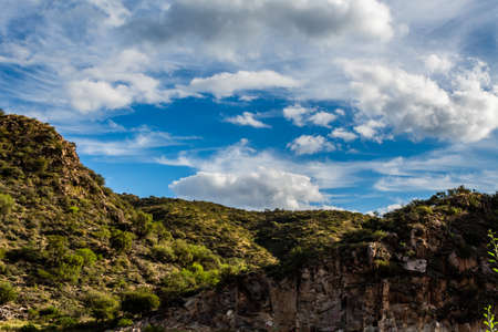 Beautiful day in valley San Luis Mountains in summer with soft cloudsの写真素材