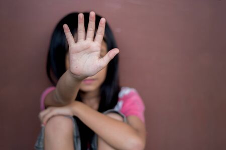 Tortured child in the family. Stop child abuse. The child who was abandoned by parents.の写真素材