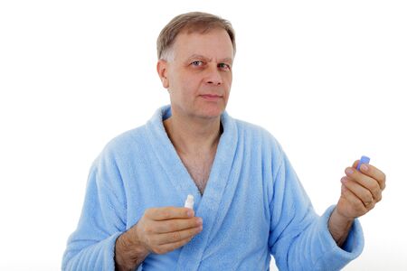 Handsome man in blue bathrobe with lipstick の写真素材