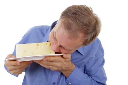 Man eating edammer cheese の写真素材