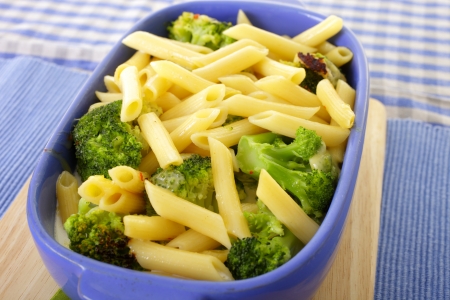 Baked broccoli and pasta in casserole dish の写真素材