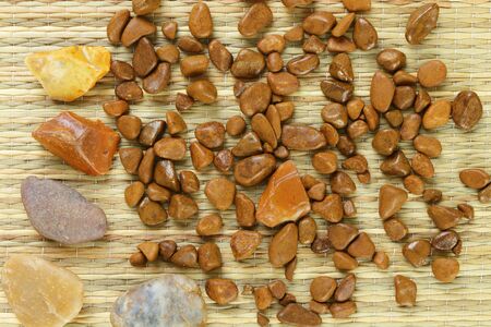 A lot of stones on a mat as a background の写真素材