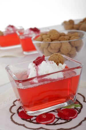Red fruit jelly with raspberries and creme の写真素材
