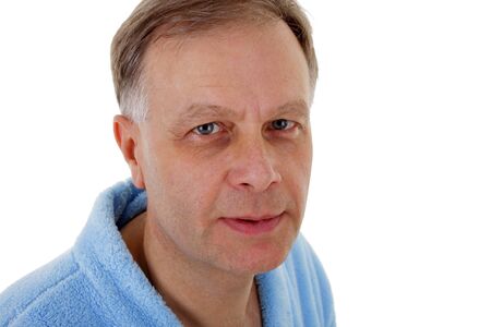 Portrait of man with blue eyes in a bathrobe の写真素材