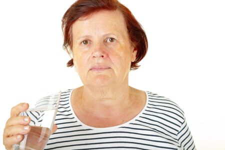 senior woman drinking waterの写真素材