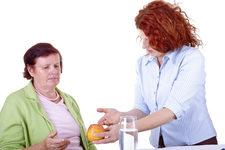 senior woman talking with dieting agent, white background の写真素材