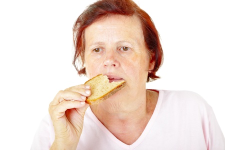 woman eating breadの写真素材