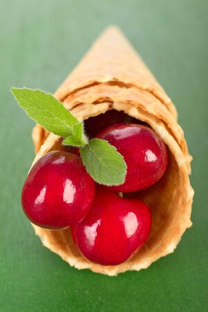 Cherry in a ice coneの写真素材