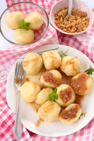 Boiled dumplings with buttered bread crumbsの写真素材