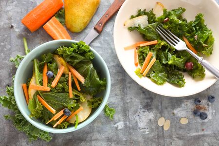 Kale salad with grated carrot and pear.の写真素材