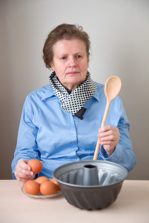 Elderly woman bakingの写真素材
