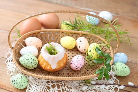 Easter food: cake and eggs in a basket