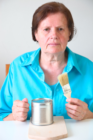 Mature woman with a brush and canの写真素材