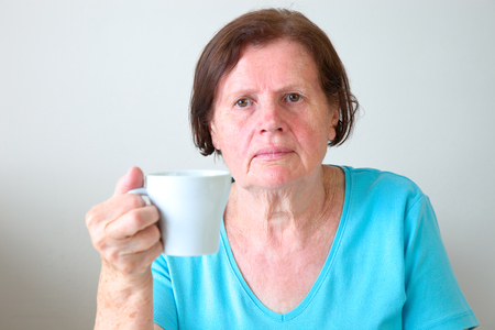 Mature woman with a coffee mugの写真素材