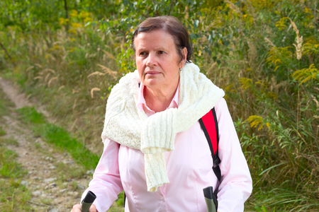 Senior lady nordic walkingの写真素材