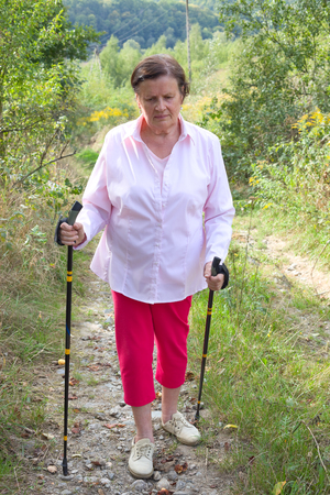Senior lady nordic walkingの写真素材