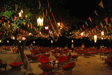 Koh Chang,Trad, Thailand, 21 April 2017, beautiful  dinner restaurant night life on white sand beach with colorful decoration hang on the big treeのeditorial素材