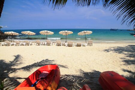 travel sea blue sky beautiful white sand beach coconut tree kayak beach umbrella fishing boat in summer koh samed island thailandの写真素材