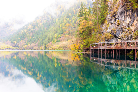 Jiuzhaigou National Park. Sichuan Province. beautiful scenic. Lake. wooden bridge. Travel. Chinaの写真素材