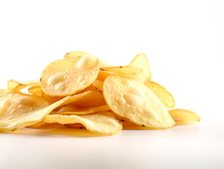 Potato chips isolated on white background. Close up. Selective focus.の素材