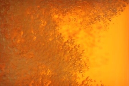 closeup of beer bubbles in motionの写真素材