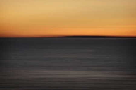 motion blur sunset at oceanの写真素材