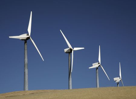 Windmill on a hill to generate electricityの写真素材