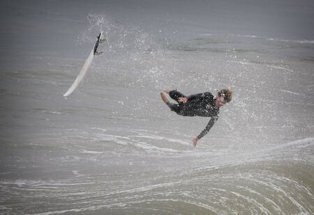 surfer in california flying over a waveの写真素材