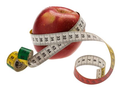 red apple with measuring tape wraped arroundの写真素材