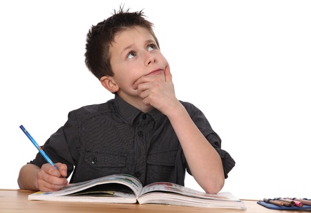 cute young boy learning with white backgroundの写真素材
