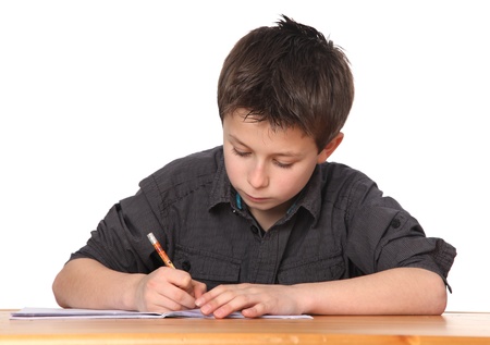 cute young boy doing homeworkの写真素材