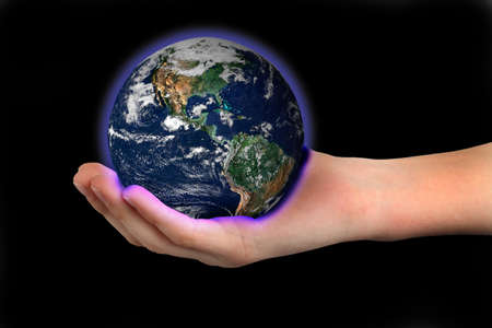 world (globe picture from NASA) in the palm of a childs handの写真素材