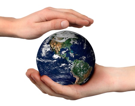 world (globe picture from NASA) in the palm of a childs handの写真素材
