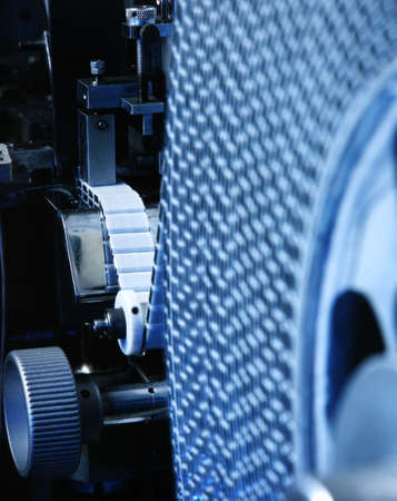detail of machine producing electronic partsの写真素材
