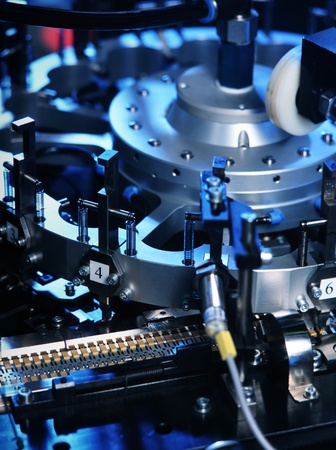 detail of machine producing electronic partsの写真素材