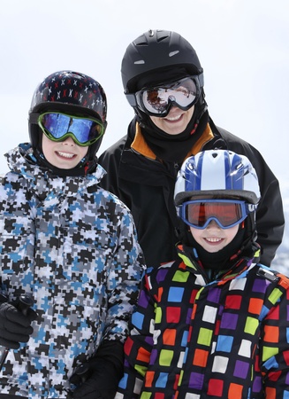 mother with two young boys skiingの写真素材