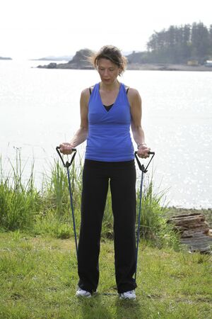 women exercising with sports equipment outdoorsの写真素材