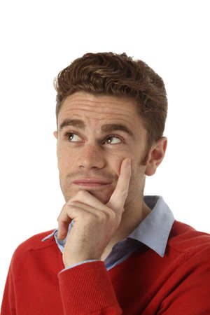 young man with red hair thinkingの写真素材