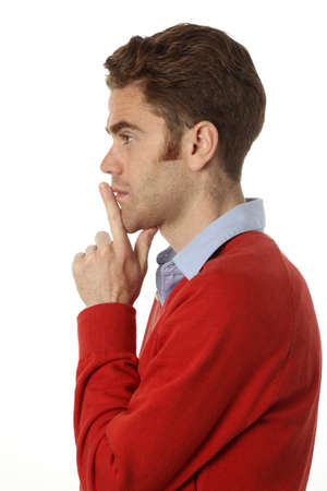 young man with red hair thinkingの写真素材