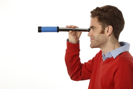 young man looking through a telescope