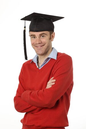 young man standing with graduation hat onの写真素材