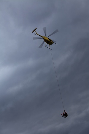yellow rescue helicoptor over the oceanのeditorial素材
