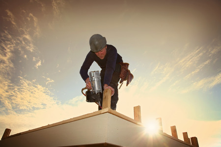 A carpenter working on a consruction site