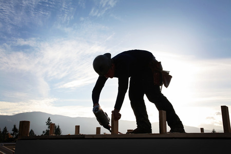 A carpenter working on a consruction siteの写真素材